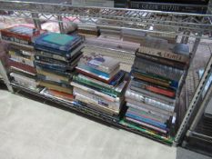 A shelf conraining books of assorted themes