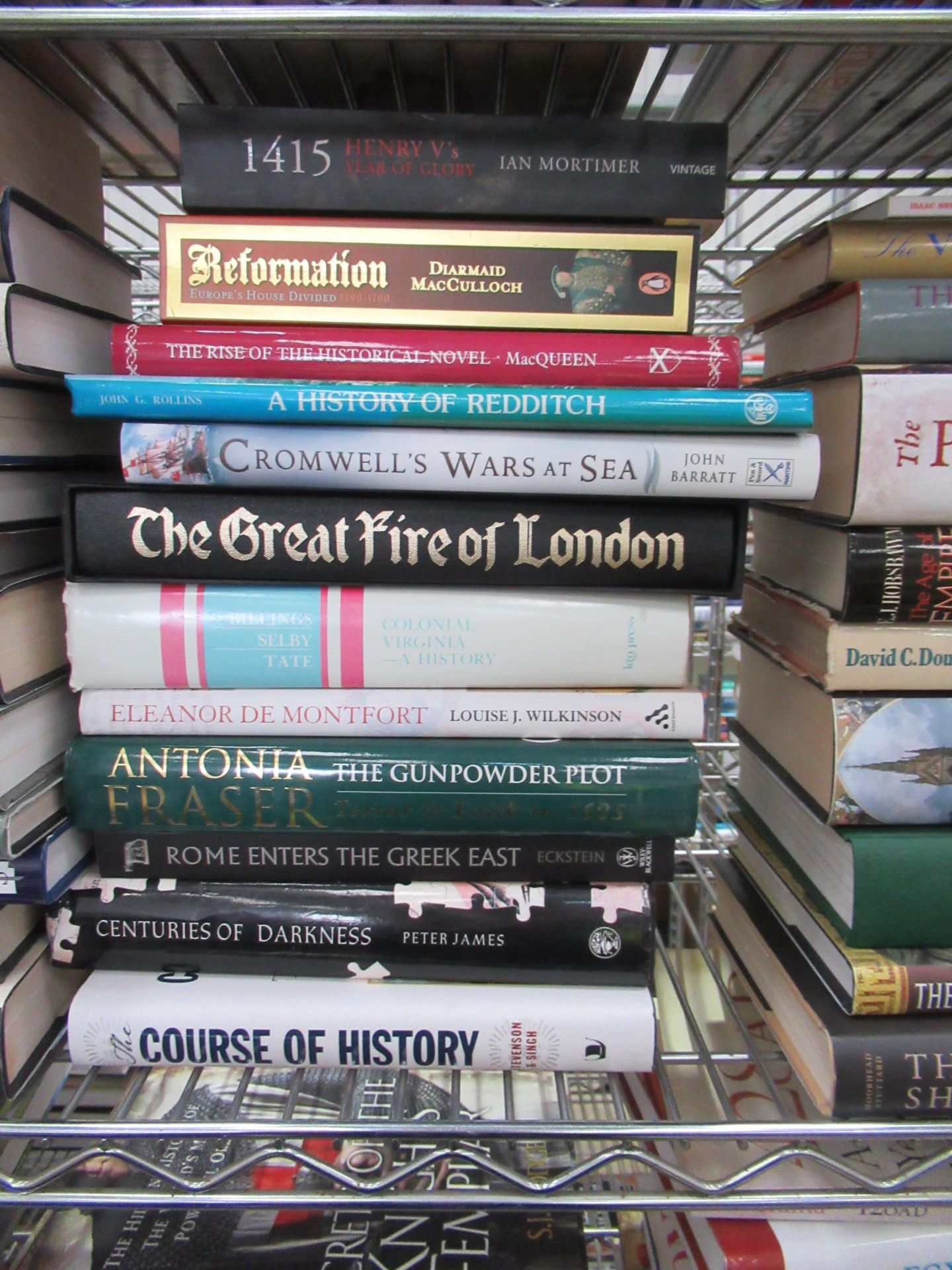 Two shelves containing an assortment of British and Global history themed books, to include 'Blood S - Image 3 of 9