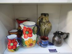 Shelf of Eight Painted Ceramic Jugs