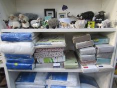 Shelf of unused and sealed Bed Sheets