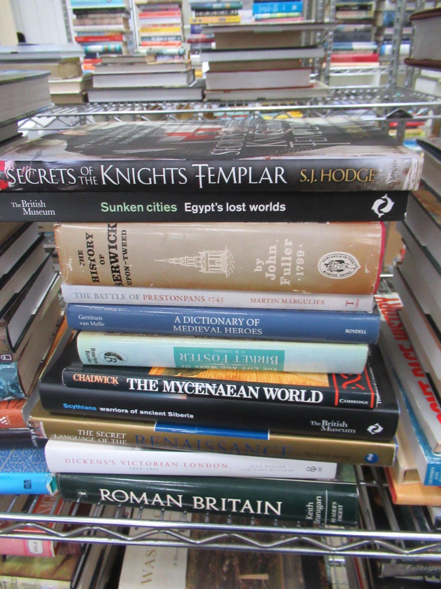 Two shelves containing an assortment of British and Global history themed books, to include 'Blood S - Image 7 of 9