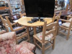 A Pine effect Extending Table and Four Chairs, Together with 2 x Matching Carver style Chairs