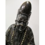 A Heavy Bronze Figure of East Asian Man Standing on a Chinese Dragon Head (78cm tall)
