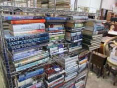 A shelf of Naval/war themed books including volumes 1-8 of 'Story of the War', Janes Fighting Ships