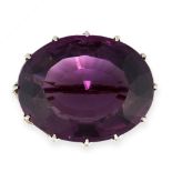 ANTIQUE AMETHYST BROOCH, EALY 20TH CENTURY claw-set with an oval amethyst weighing approximately