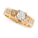 A DIAMOND DRESS RING in 18ct yellow gold, set with a principal round cut diamond of 0.70 carats