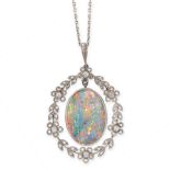 A BLACK OPAL AND DIAMOND PENDANT in yellow gold and silver, set with an oval cabochon black opal