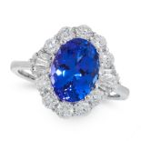 A TANZANITE AND DIAMOND DRESS RING in 18ct white gold, set with an oval cut tanzanite of 3.33