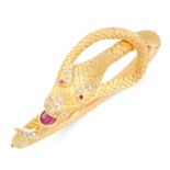 A RUBY AND DIAMOND SNAKE BANGLE in high carat yellow gold, designed as the body of a snake, coiled