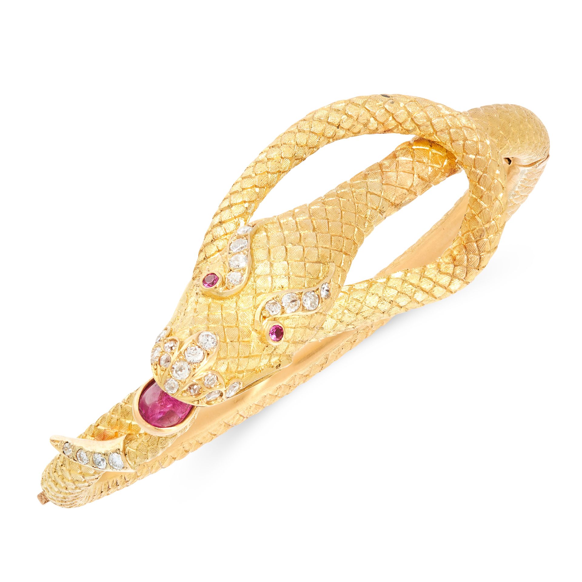 A RUBY AND DIAMOND SNAKE BANGLE in high carat yellow gold, designed as the body of a snake, coiled