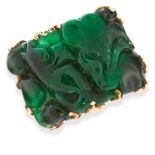 A CARVED JADEITE JADE COCKTAIL RING in high carat yellow gold, set with a carved and polished