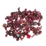 A MIXED LOT OF UNMOUNTED GARNETS various cuts and sizes, totalling 166.43 carats.