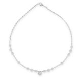A DIAMOND LINE NECKLACE in 18ct white gold, formed of a row of round cut diamonds punctuated by