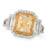A YELLOW DIAMOND AND DIAMOND RING in 18ct white gold, set with a radiant cut yellow diamond of 3.