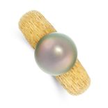 A VINTAGE PEARL DRESS RING in 18ct yellow gold, the tapering textured band set with a black pearl of