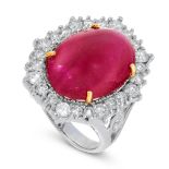 A RUBY AND DIAMOND DRESS RING in 18ct white gold, set with an oval cabochon ruby of 11.39 carats,