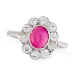 A VINTAGE RUBY AND DIAMOND DRESS RING in 18ct white gold, set with an oval cabochon ruby of 1.50