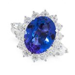 A TANZANITE AND DIAMOND DRESS RING in 18ct white gold, set with an oval cut tanzanite of 5.97