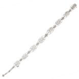 A DIAMOND BRACELET, EARLY 20TH CENTURY formed of eight oval links set with rose cut diamonds in