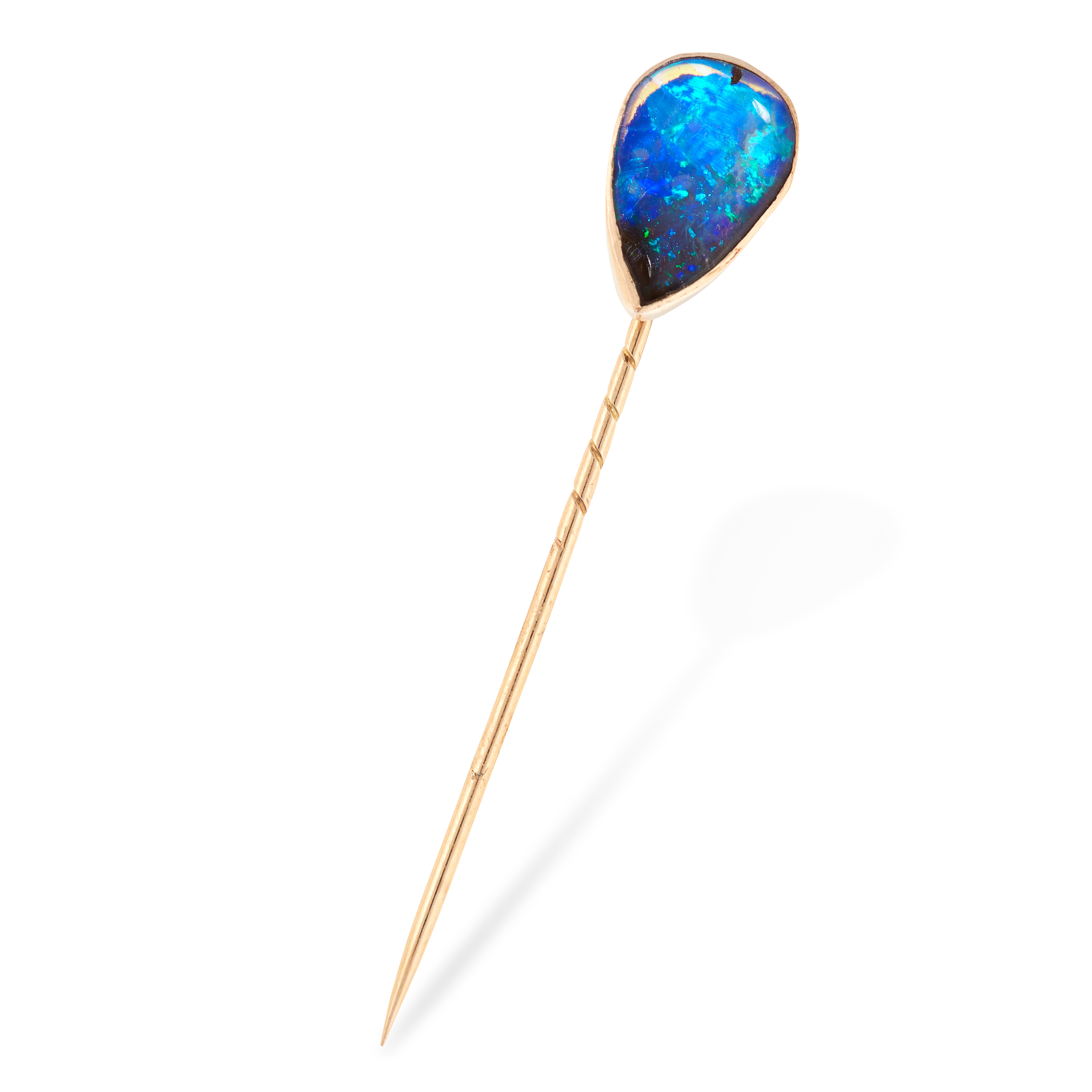 AN ANTIQUE OPAL TIE PIN / BROOCH in yellow gold, set with a pear shaped cabochon opal, unmarked, 5.