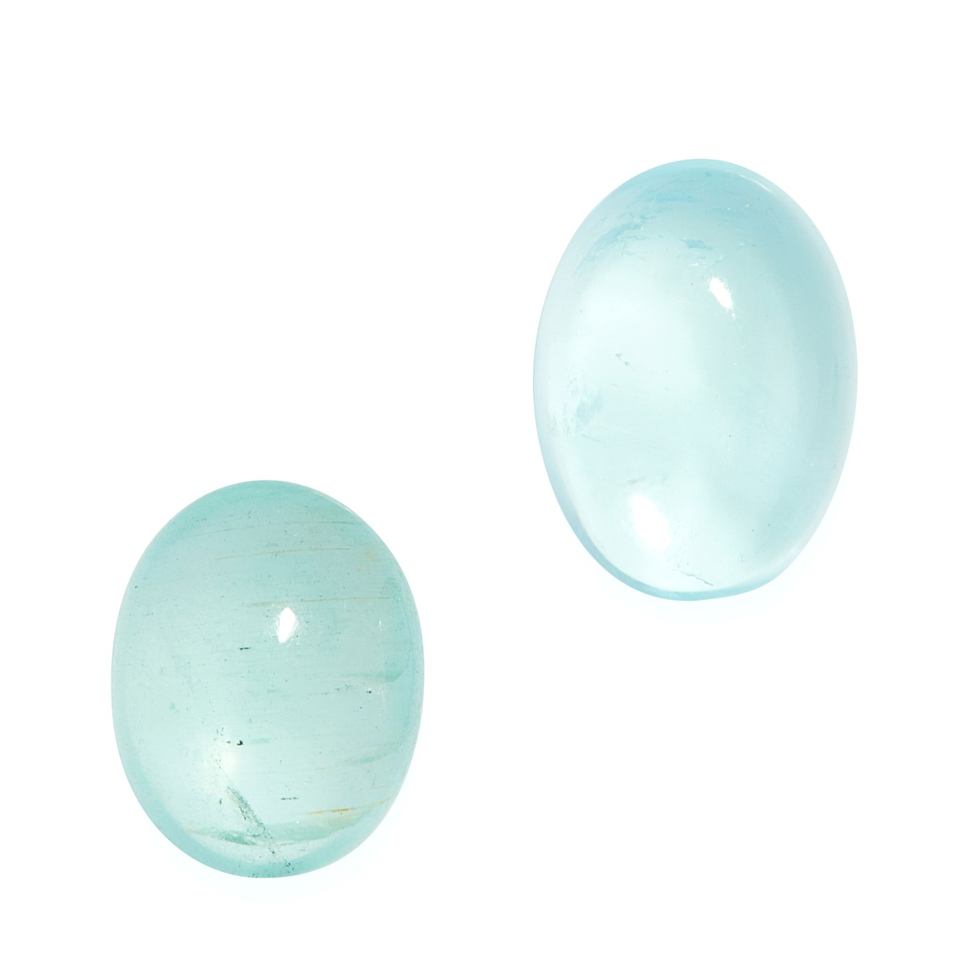 TWO UNMOUNTED AQUAMARINES oval cabochon cut, both totalling 7.70 carats.