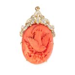 A CORAL AND DIAMOND PENDANT / BROOCH in 14ct yellow gold, the body set with a large oval piece of