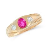 A RUBY AND DIAMOND DRESS RING in high carat yellow gold, the tapered band set with a cushion cut