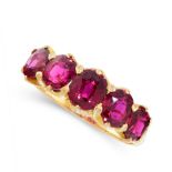 AN UNHEATED RUBY DRESS RING, CIRCA 1900 in 18ct yellow gold, set with five graduated cushion cut