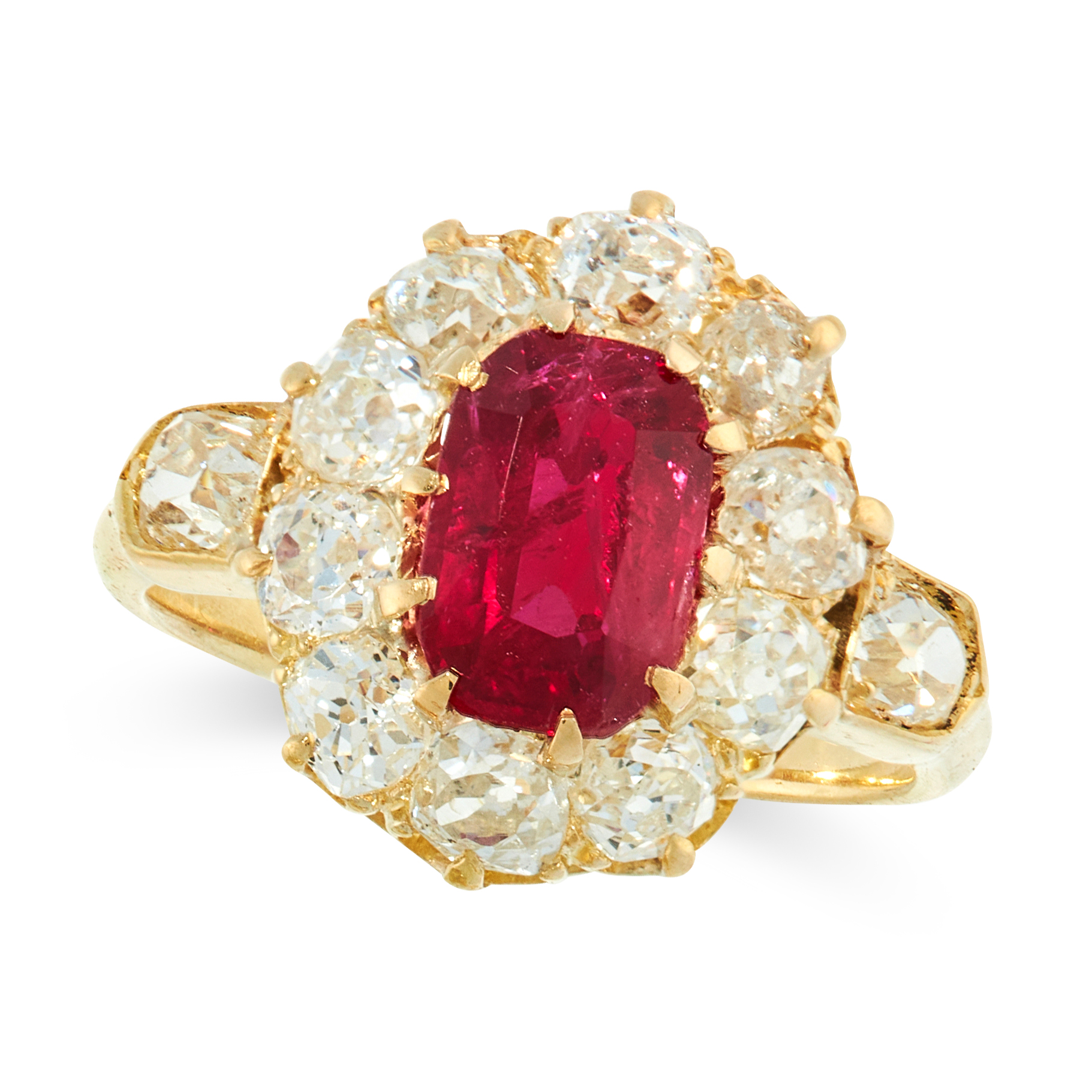 AN ANTIQUE RUBY AND DIAMOND DRESS RING in high carat yellow gold, set with a cushion cut ruby of 1.
