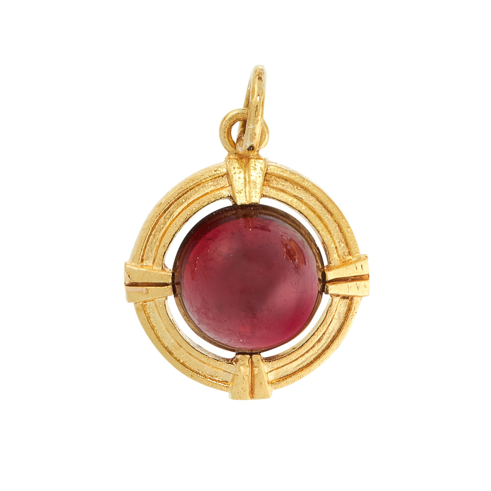 AN ANTIQUE GARNET PENDANT / CHARM in 15ct yellow gold, set with a round cabochon garnet within a
