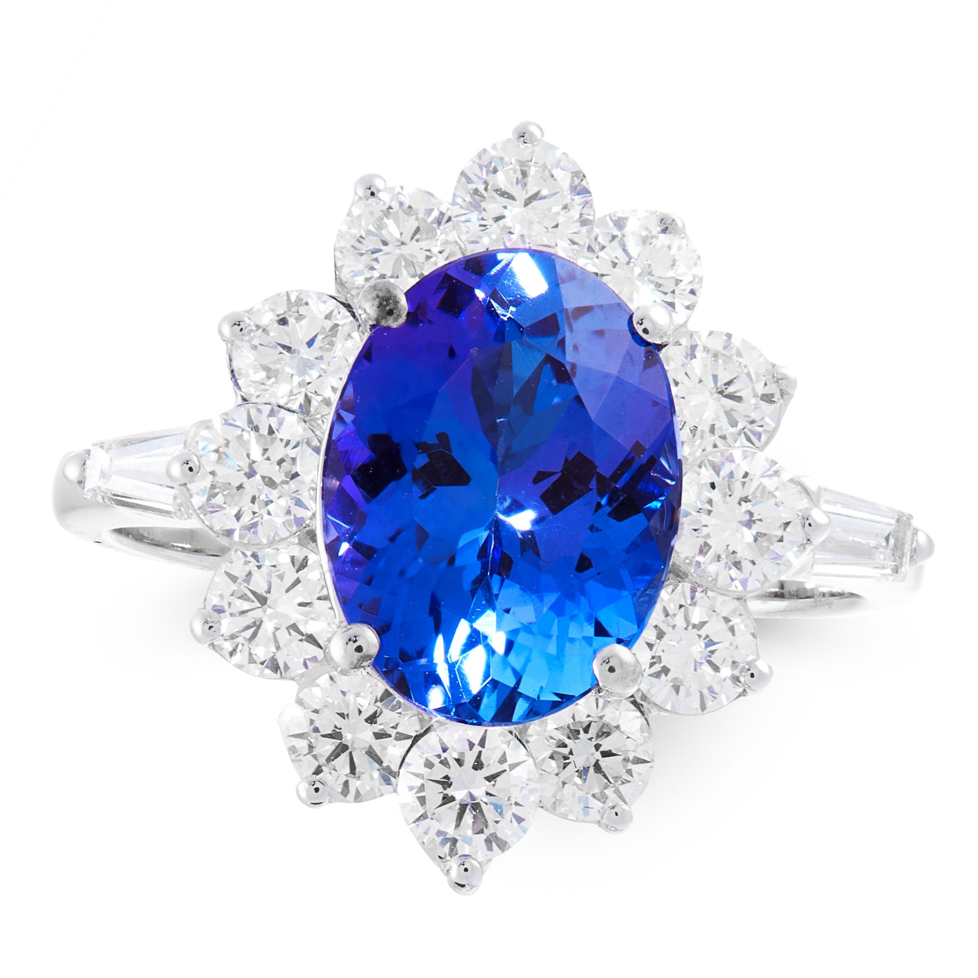 A TANZANITE AND DIAMOND DRESS RING in 18ct white gold, set with an oval cut tanzanite of 3.66