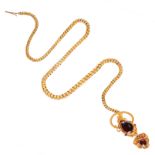 AN ANTIQUE GARNET MOURNING LOCKET SNAKE NECKLACE, 19TH CENTURY in yellow gold, designed as the
