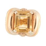 A VINTAGE CITRINE DRESS RING in 18ct yellow gold, set with an emerald cut citrine within a ribbon