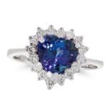 A TANZANITE AND DIAMOND DRESS RING in 18ct white gold, set with a heart shaped brilliant cut