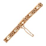 AN ANTIQUE DIAMOND AND PEARL BRACELET, CIRCA 1900 in 15ct yellow gold, the gate link design set with