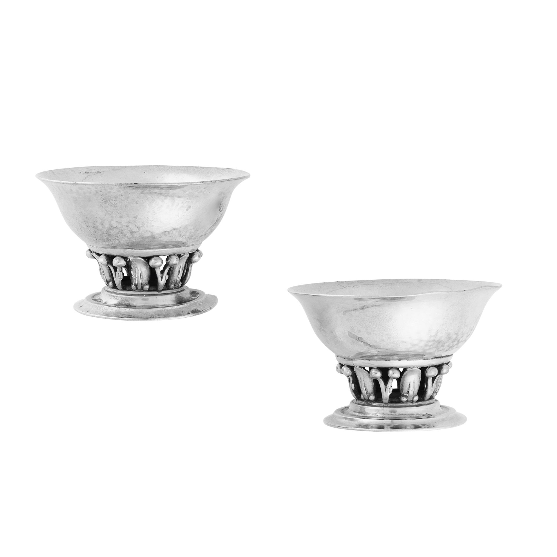 A PAIR OF VINGAGE SALT CELLARS, GEORG JENSEN CIRCA 1930 in silver, design number 180, the hammered