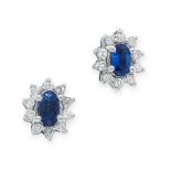 A PAIR OF SAPPHIRE AND DIAMOND STUD EARRINGS in 18ct white gold, each set with an oval cut blue