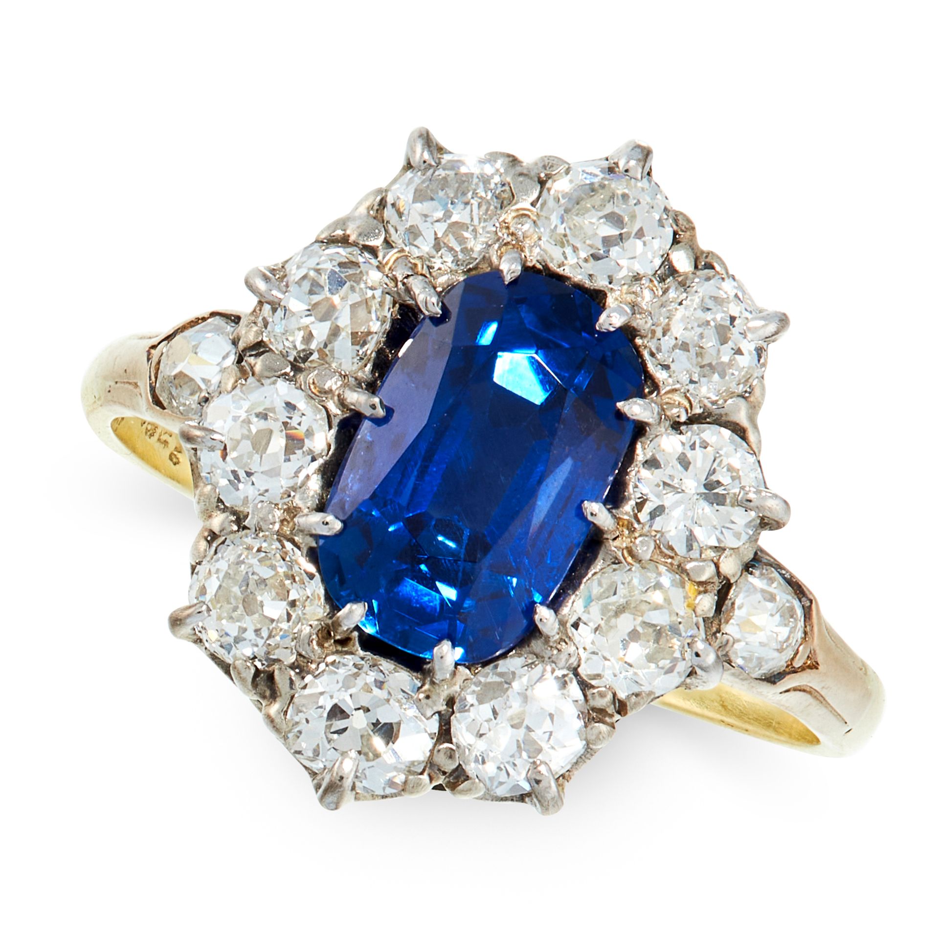 A BURMA NO HEAT SAPPHIRE AND DIAMOND DRESS RING in 18ct yellow gold, set with a cushion cut blue