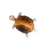 A TIGER'S EYE, RUBY AND DIAMOND TURTLE BROOCH in yellow gold, the shell formed of a carved piece