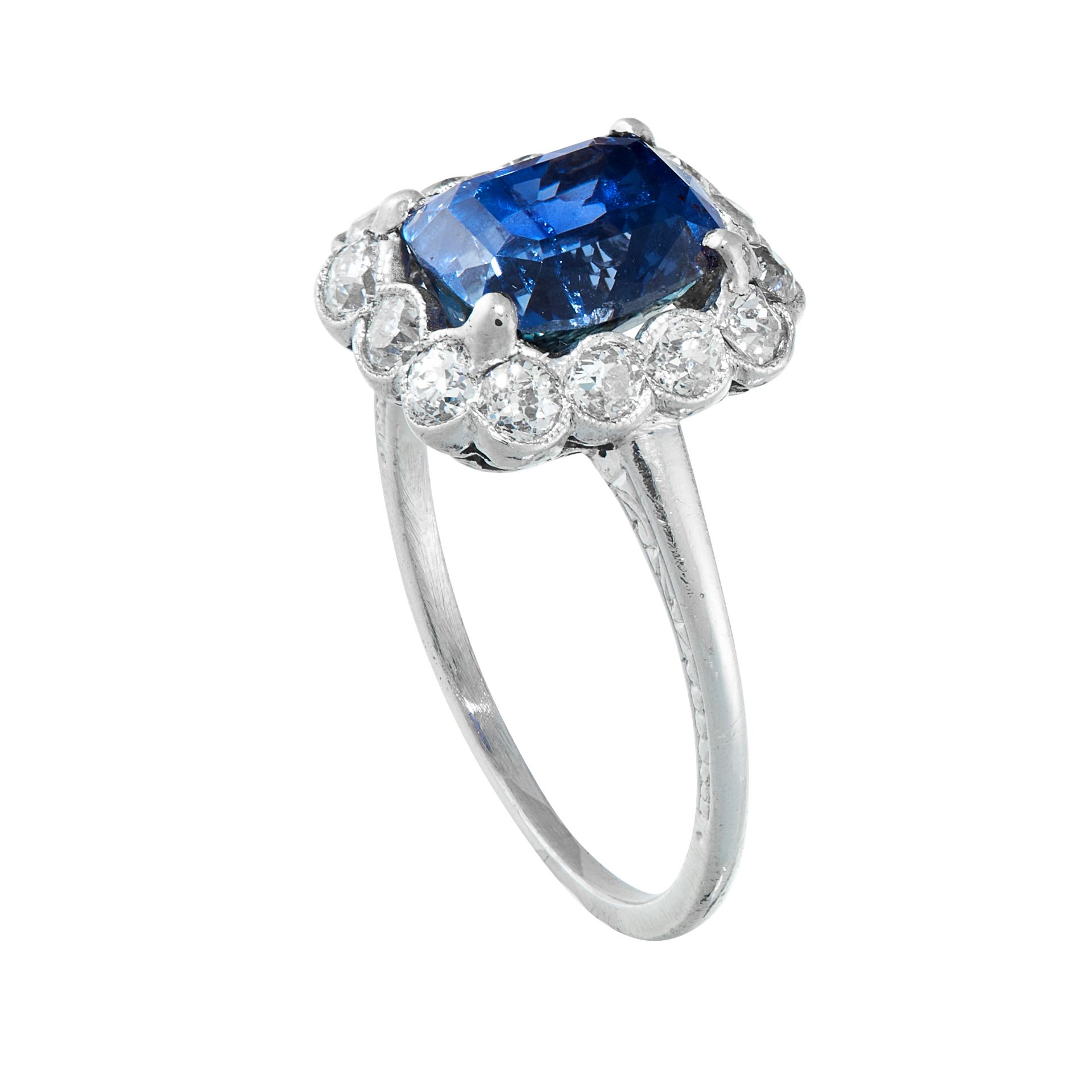 A CEYLON NO HEAT SAPPHIRE AND DIAMOND DRESS RING in platinum, set with a cushion cut blue sapphire - Image 2 of 2