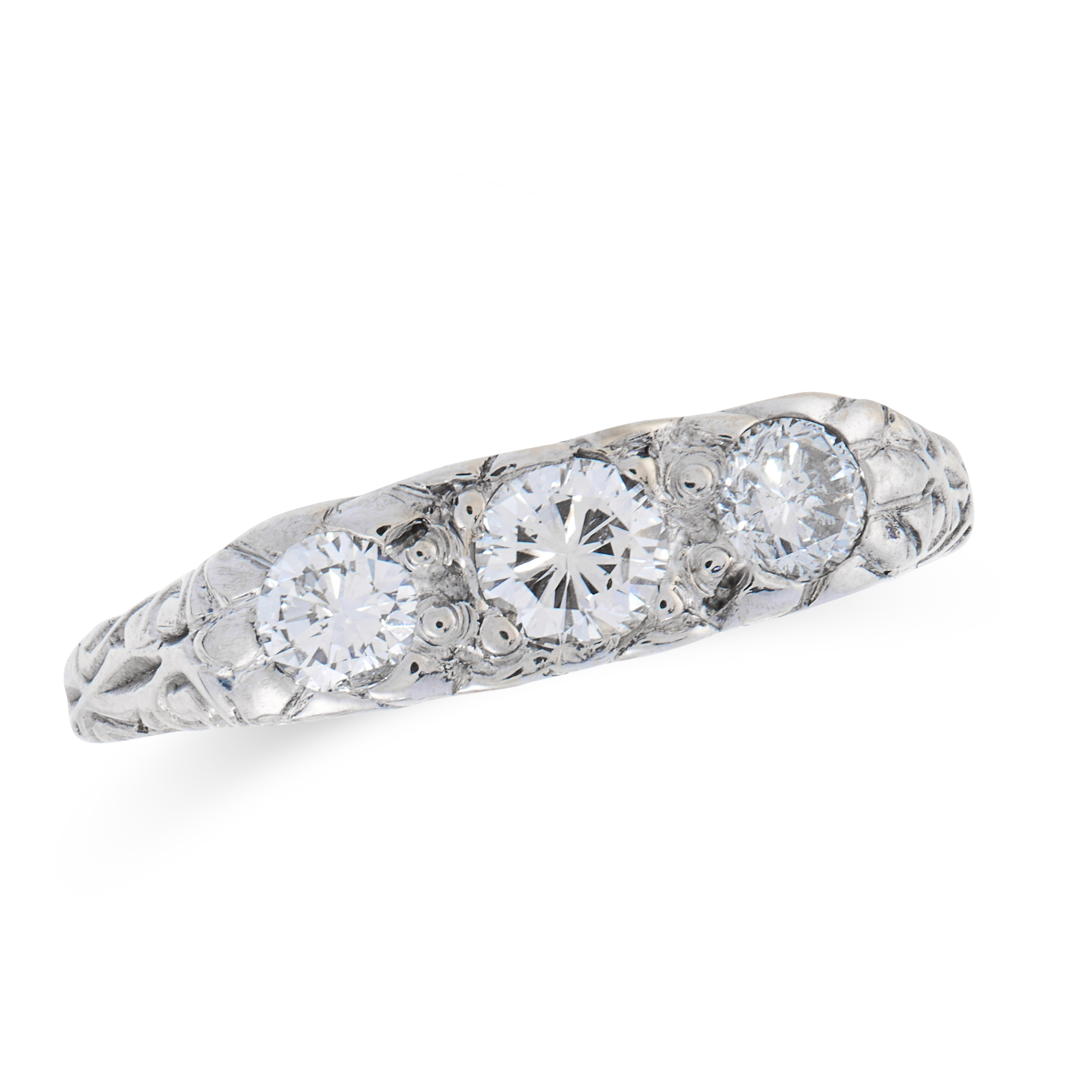 A DIAMOND THREE STONE DRESS RING set with a trio of graduated round cut diamonds, with scrolling