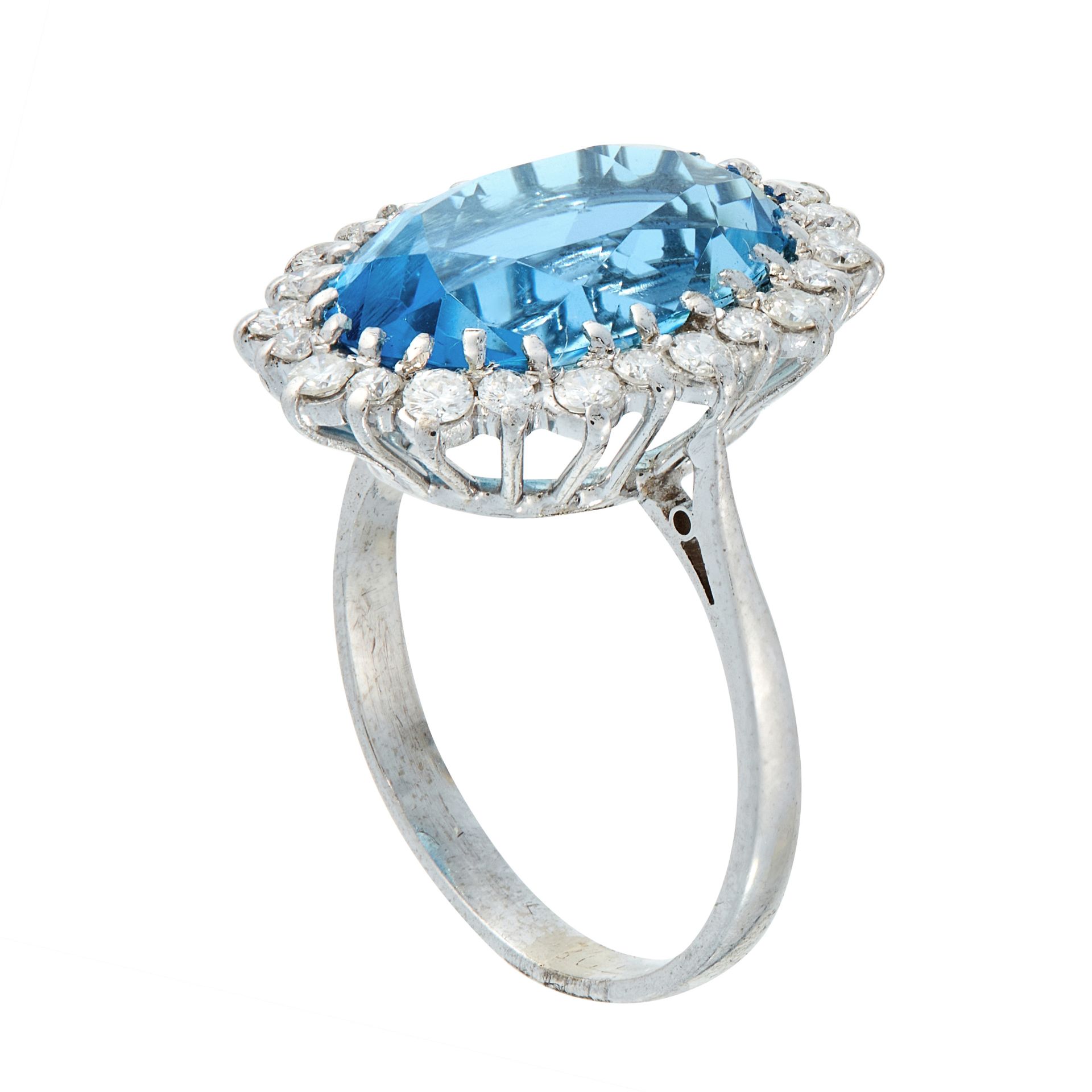 AN AQUAMARINE AND DIAMOND DRESS RING set with an oval cut aquamarine of 6.12 carats, within a border - Image 2 of 2