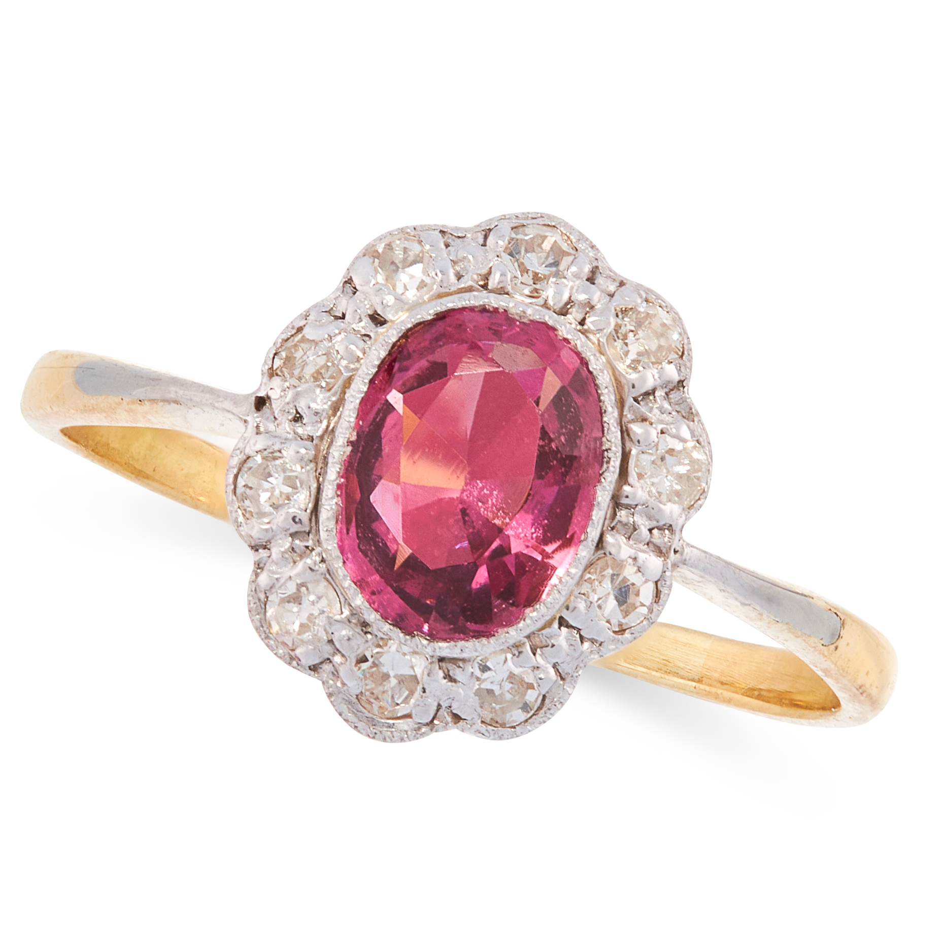 A SPINEL AND DIAMOND DRESS RING, EARLY 20TH CENTURY in high carat yellow gold, set with an oval