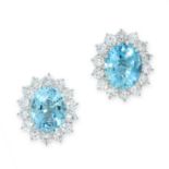 A PAIR OF AQUAMARINE AND DIAMOND STUD EARRINGS each set with an oval cut aquamarine of 2.94 carats