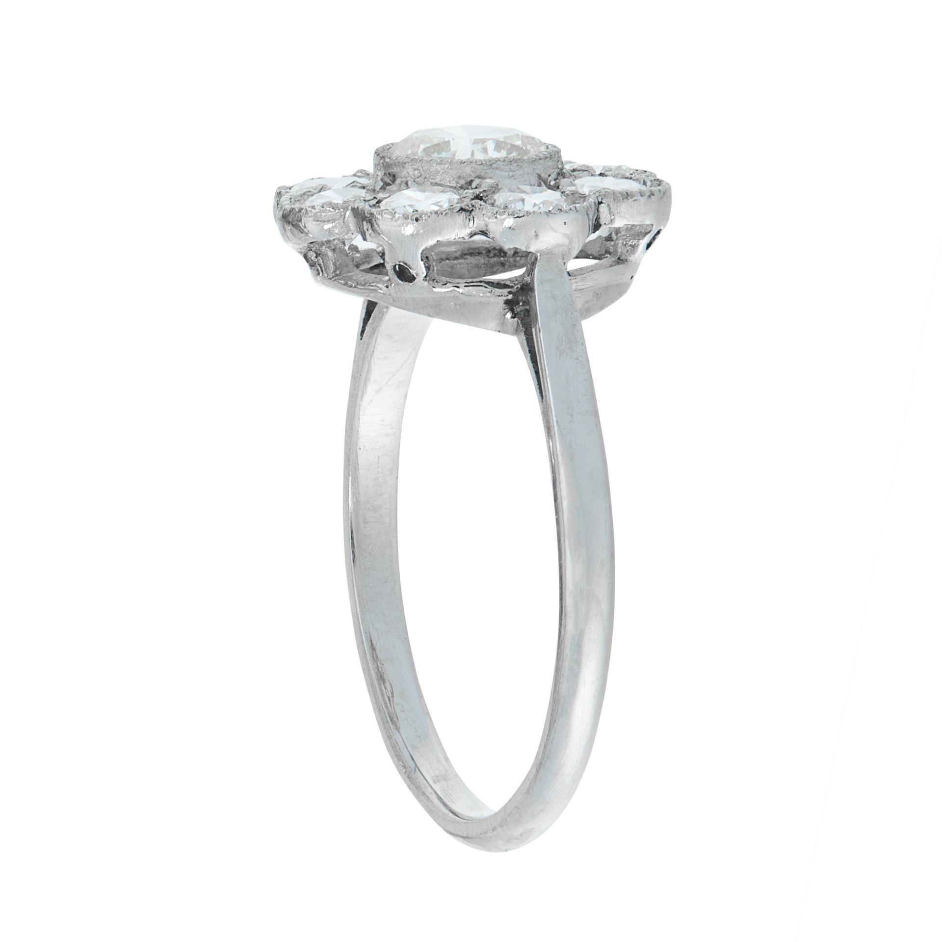 A DIAMOND CLUSTER DRESS RING set with a central round cut diamond within a border of eight further - Image 2 of 2