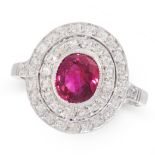 A RUBY AND DIAMOND DRESS RING in platinum, set with an oval cut ruby of 1.23 carats within a