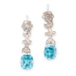 A PAIR OF BLUE ZIRCON AND DIAMOND EARRINGS, EARLY 20TH CENTURY each set with an emerald cut blue