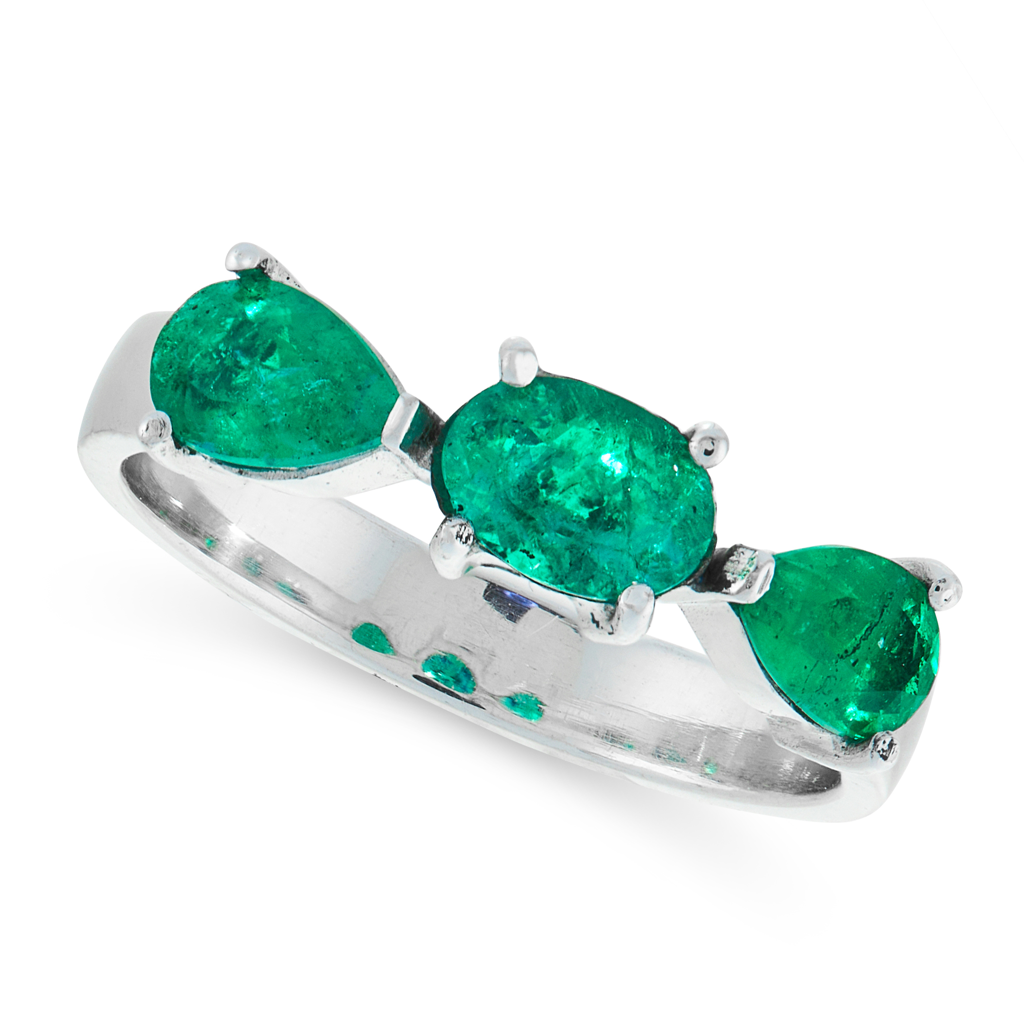 AN EMERALD DRESS RING in 18ct white gold, set with a trio of oval cut and pear cut emeralds, stamped