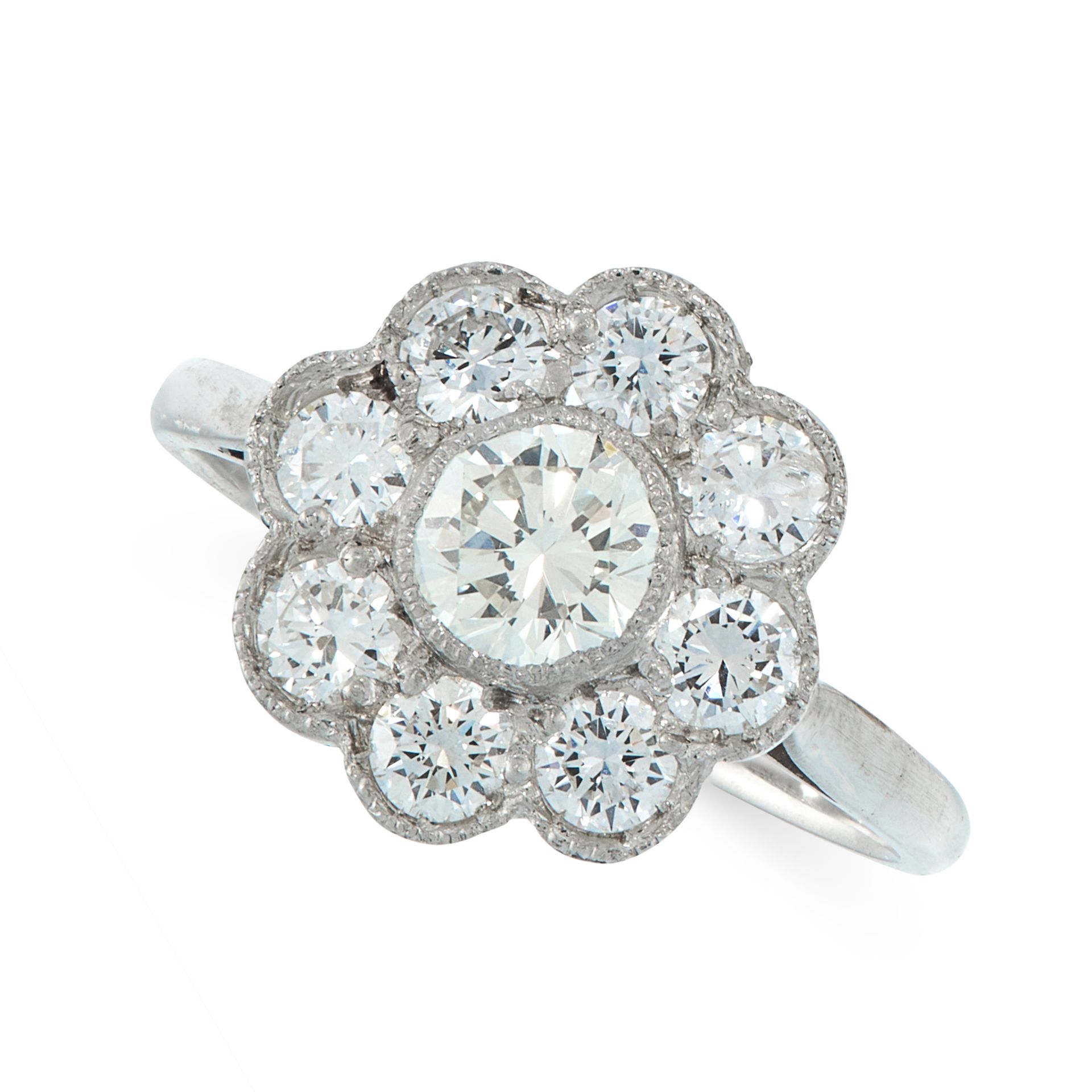 A DIAMOND CLUSTER DRESS RING set with a central round cut diamond within a border of eight further