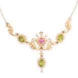 AN ANTIQUE PINK TOURMALIE, PERIDOT AND PEARL SUFFRAGETTE NECKLACE in yellow gold, formed of clusters